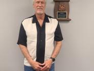 Gerald T Buhr with Plaque in Commission Chambers of the Building Named after him.